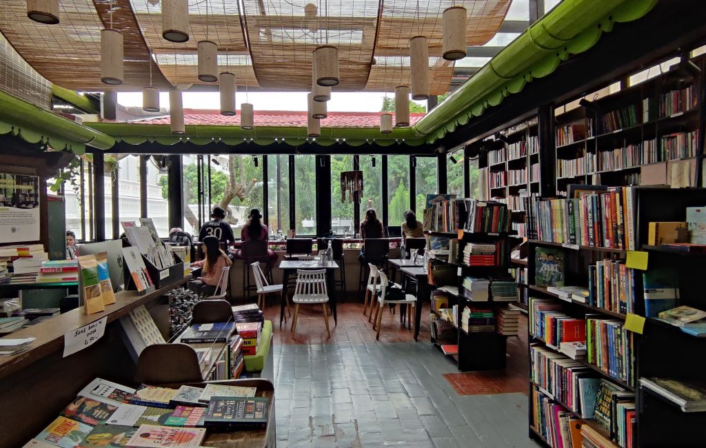 A Book cafe surrounded by shelves and furniture